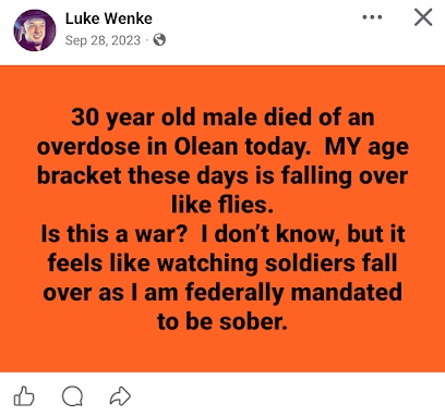 September 28, 2023, Facebook post by Luke Wenke claiming that a 30-year-old man died of a drug overdose in Olean, New York. Wenke expresses concern about overdose deaths among people his age, compares the situation to soldiers dying in a war, and references his own federally mandated sobriety.